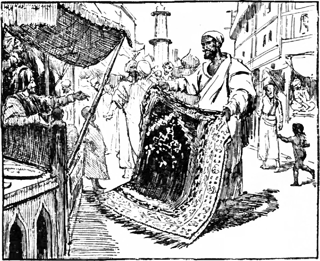 A bearded man in a turban stands in a sunlit street holding up a large dark patterned carpet by its top corners, its fringed end trailing on the ground, while a man seated in a matting-roofed shop at the left leans out and points at it, turbaned onlookers press behind the carpet under a tall column, and at the right a woman with a staff and a naked child walk past the house fronts